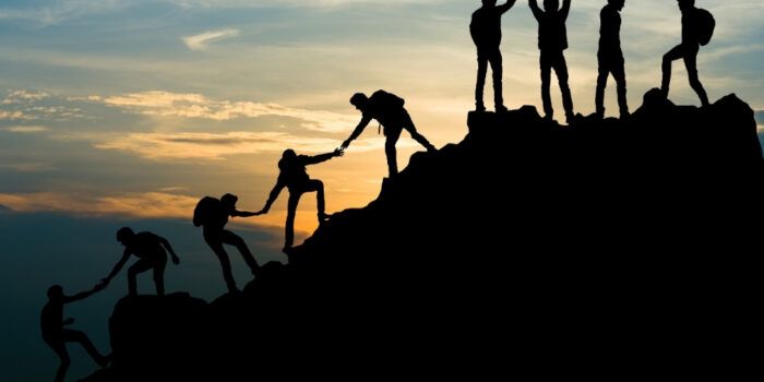 Leaders helping each other on the journey to the top