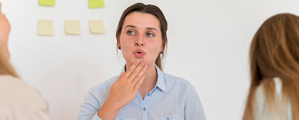 A woman practicing her facial expressions