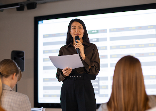 Professional delivering a storytelling-led presentation to an engaged audience